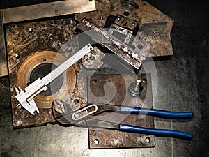 top view of callipers and pliers on workbench