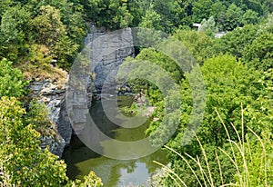 Top view of the calm river in canyon among forest