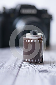 Top view of camera with film rolls on table