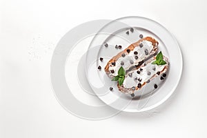 Top View Cannoli Siciliani On Round Plate On Wihte Backgound