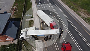 Top view of a car accident involving a truck and a bus. Filming from a drone