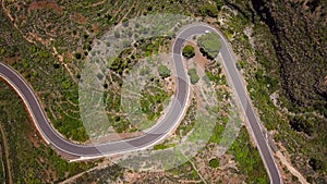 Top view of a car rides along a mountain road on Tenerife, Canary Islands, Spain. Way to the Teide volcano, Teide