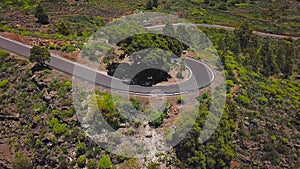 Top view of a car rides along a mountain road on Tenerife, Canary Islands, Spain. Way to the Teide volcano, Teide