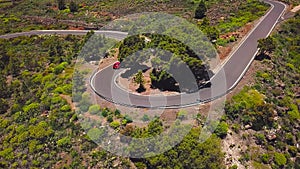 Top view of a car rides along a mountain road on Tenerife, Canary Islands, Spain. Way to the Teide volcano, Teide