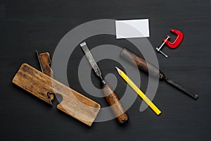 Top view of carpenter tools equipment set on wooden table