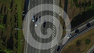 Top view cars driving on highway road. Car traffic on freeway interchange