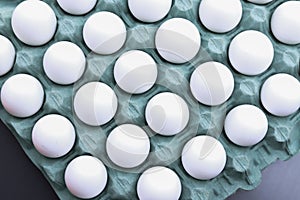 Top view of a carton of white eggs