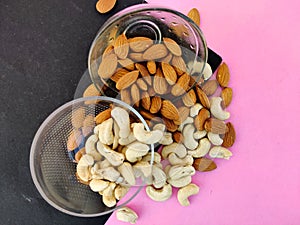 Top view of cashew nuts and almonds split