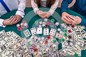 Top view of casino playing desk with players hands