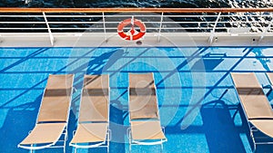 Top view of chairs on upper deck of cruise liner