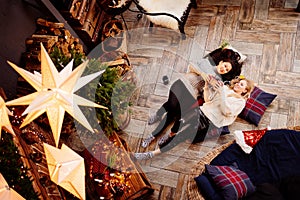 top view. cheerful girlfriends in the New Year& x27;s decorations in the fireplace