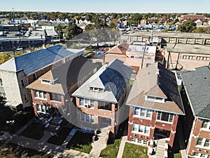 Top view Chicago classic townhomes with front yard and parked ca