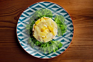 Top view on chicken corn and pineapple salad with leaf salad