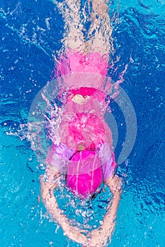 Top View of Child or Kid Swimming in Swimming Pool