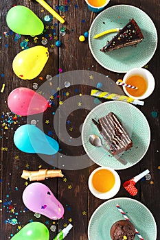 Top view children birthday table chocolate cake decoration party