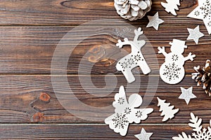 Top view of Christmas decorations and toys on wooden background. Copy space. Empty place for your design. New Year concept