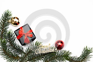 Top view of Christmas gift box red balls with spruce branches, pine cones, red berries and bell on white background