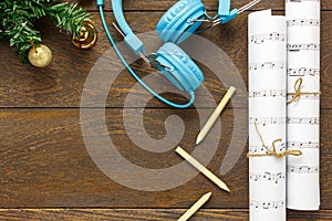 Top view Christmas music note paper with Christmas decoration a