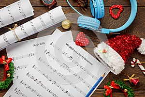 Top view Christmas music note paper with Christmas decoration a