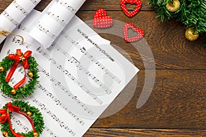 Top view Christmas music note paper with Christmas decoration o