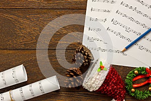 Top view Christmas music note paper with Christmas decoration o