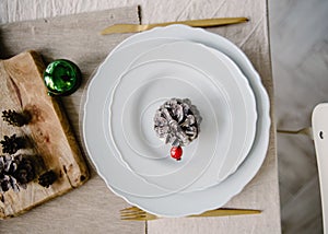 Top view Christmas and New Year table setting in scandinavian style with rustic handmade details in natural and white