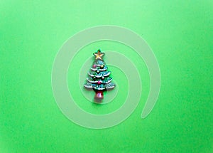 top view Christmas trees on green background. Free copy space. Concept of decoration, greeting cards