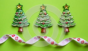 top view Christmas trees on green background. Free copy space. Concept of decoration, greeting cards. web banner