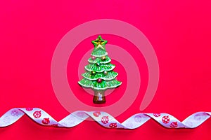 top view Christmas trees on red background. Free copy space. Concept of decoration, greeting cards