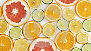 Top view of citrus fruits, Orange, tangerine, lemon, lime and grapefruit slices or circles isolated over white