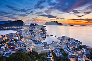 Top view of the city of Alesund at sunset .