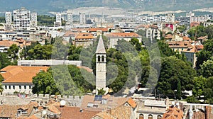 Top view of the city from the bell tower, roofs of houses and church in old town, beautiful cityscape, sunny day, Split, Croatia