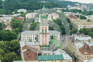 Top view from city hall tower on old high catholic cathedral tower in Lviv city, Ukraine