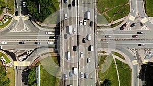 Top view of a city intersection with buses, cars, trucks. Traffic at daytime, roadcross in the megapolis.