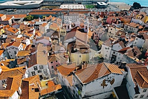 Top view of the city, narrow streets and roofs of houses with red tiles Lisbon