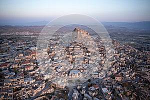 Top view of the city of Ortahisar at sunset.