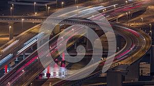 Top view city traffic on a big crossroad in Business bay night timelapse.