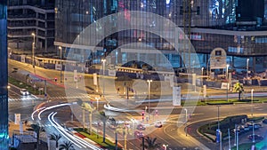 Top view city traffic on a crossroad in Dubai Business bay night timelapse.