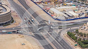 Top view city traffic on a crossroad in Dubai Downtown .