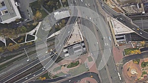 Top view city traffic of highway, logistics. Clip. Aerial top view of road junction from above, automobile traffic and