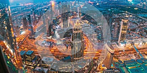 Top View Cityscape Skyline Of Dubai. Aerial View Of Evening Night Traffic Of Residential District. Night Scenic View Of