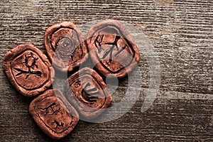 View of clay talismans with signs photo