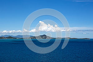Top view from the cliff of Ko Samui Island with blue sea and white cloud in Thailand.