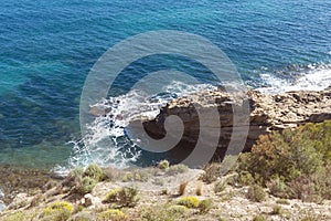 Top view of cliffs, bays, clear sea - nature background