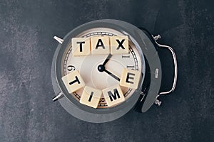 Square letters with word TAX TIME