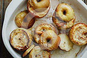 Top view apples topped nuts honey cinnamon baking wooden table