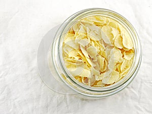 Top view close up of cornflakes in grasses bottle