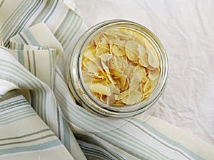 Top view close up of cornflakes in grasses bottle