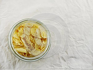 Top view close up of cornflakes in grasses bottle