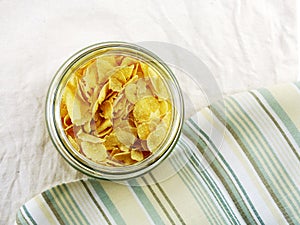 Top view close up of cornflakes in grasses bottle